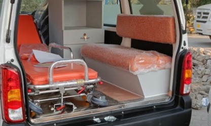 Patient stretcher trolley inside ambulance, ready for safe transport in Faridabad